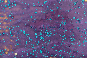 Close view of a colorful blue and purple icing toaster pastry.