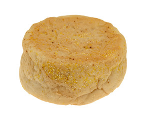 Side view of a large size freshly baked English muffin isolated on a white background.