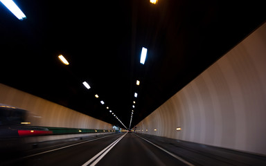 Fototapeta na wymiar Motion Blur Driving Car at Speed Through a Tunnel