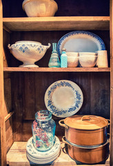 kitchen objects on wooden shelf