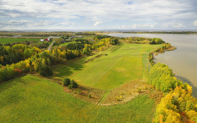 Fototapeta na wymiar Autumn aerial view of farmland and lake
