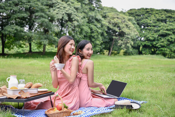 picnic concept. Beautiful girl eating out on vacation. Young business people want to rest on holiday.