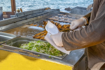 Istanbul Restaurant terrace boats Golden Horn Galata bridge waterfront tower selling hot mackerel fish balik ekmek Eminonu