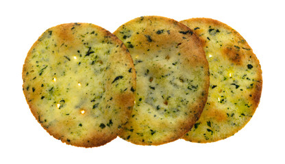 Top view of three garlic and cheese flavored potato crackers in a row isolated on a white background.