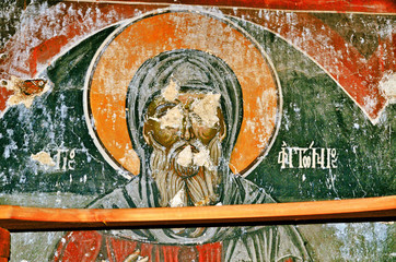 Fototapeta premium Destroyed frescoes from the ancient church of Saint Athanasios (1614) in Tsaritsani, Elassona, Greece