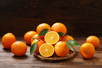 fresh orange fruits on wooden table