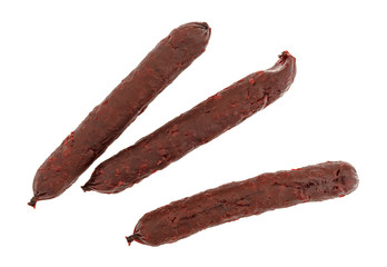 Top view of three barbecue flavor small smoked pork sausages isolated on a white background.