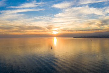 Fototapeta na wymiar Aerial view of a Sunset on the Leman Lake in Ouchy waterfront in Lausanne, Switzerland