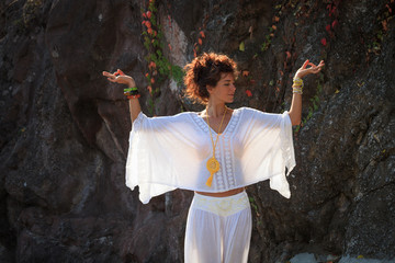 woman practice yoga outdoor autumn day hands in mudra  gesture