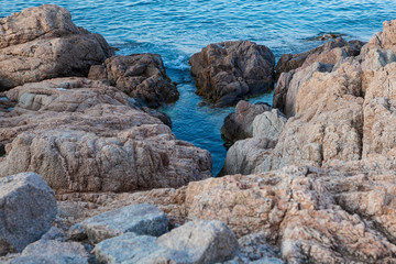 Rocks, waves and surf on the coastline shores and beach