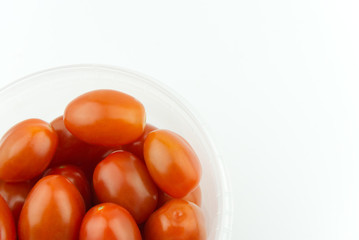 Small fresh tomatoes in box