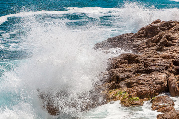 Rocks, waves and surf on the coastline shores and beach