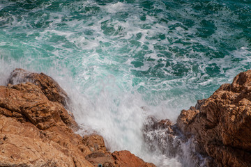 Rocks, waves and surf on the coastline shores and beach