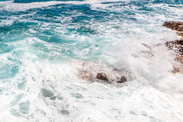 Obraz premium Rocks, waves and surf on the coastline shores and beach