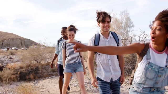 Excited adult friends exploring in Palm Springs, close up