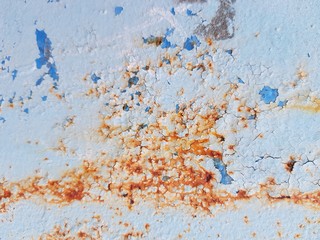 Blue with white peeling painted rusty wall texture