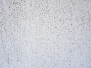 The texture of rough plaster.