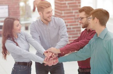 Group of people hands together partnership teamwork.