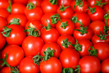 Fresh red tomato abstract fruit colorful pattern texture background. Shallow depth of field.