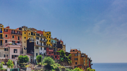 Fototapeta na wymiar Colorful houses on hills in Corniglia, Cinque Terre, Italy