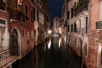 Fototapeta na wymiar A medieval canal and bridge in Venice
