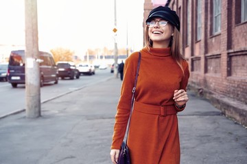 Fototapeta premium season and people concept - Autumn portrait of happy girl. Outdoor beauty portrait woman, fashion model, pretty girl, street style.