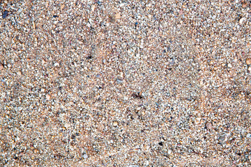 closeup of sand pattern of a beach in the summer.sand texture from sand pile.