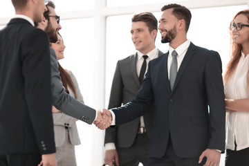 Business partners shaking hands as a symbol of unity