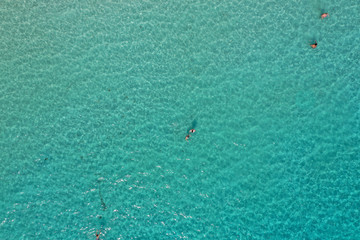 A top down photo of a lonely swimmer in the ocean