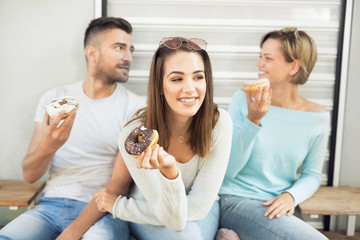 Beautiful woman eating a donut