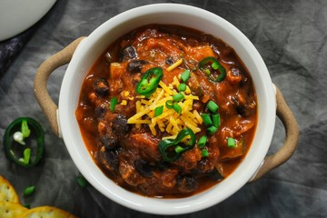 Homemade Black beans Beef Chili topped with cheddar cheese and green onions