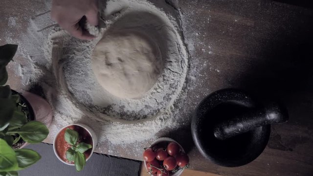 Macking pizza in slow motion - top view