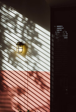 Brass Lamp on Wall with Blinds