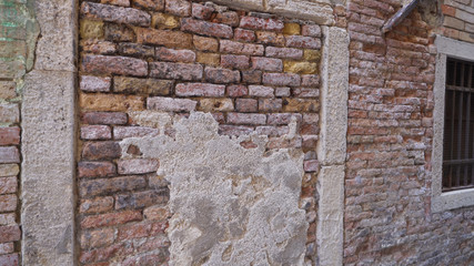 Background of old multicolored vintage brick wall in Venice Italy