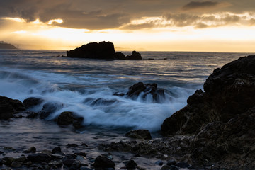Pacific Ocean Washing over the Rocks at the Coast