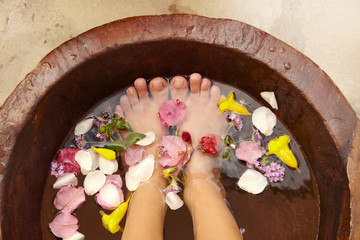 Hispanic woman receiving a foot massage and pedicure at luxury spa