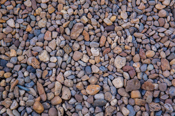 Sea pebbles. Small stones gravel texture background.Pile of pebbles, thailand.Color stone in background.