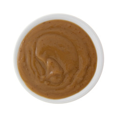 Top view of a serving of mocha instant pudding in a small bowl isolated on a white background.