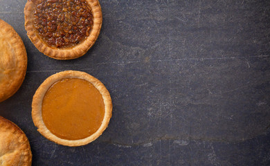 Holiday Table Set with Various Flavors of Fresh Baked Pies © pamela_d_mcadams