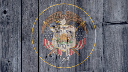 USA Politics News Concept: US State Utah Flag Wooden Fence