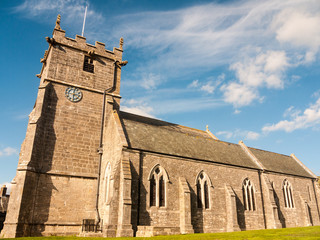 Fototapeta na wymiar beautiful christian church corfe castle dorset full view summer blue sky cross
