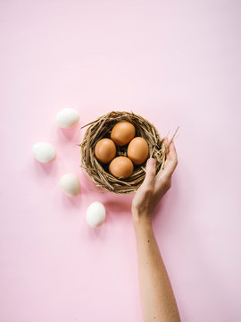 Crop person serving?Easter eggs