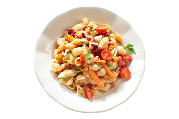 Vegetarian vegetable pasta. Pasta shells with tomato, baby carrot, paprika, beans, sweet corn and chickpea.
 Isolated on white background.  Top view.
