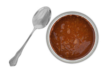 Top view of an open can of hot dog chili sauce with a spoon to the side isolated on a white background.