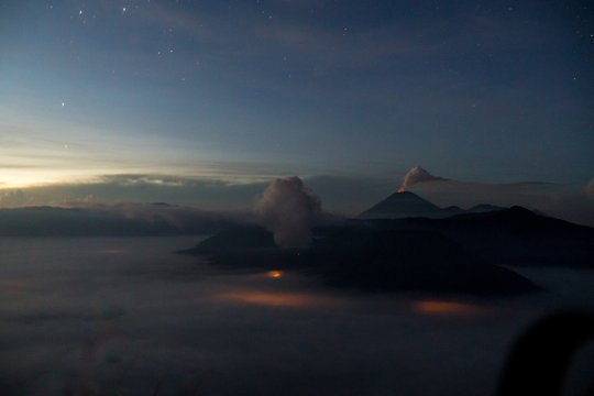 Glowing volcanoes at night