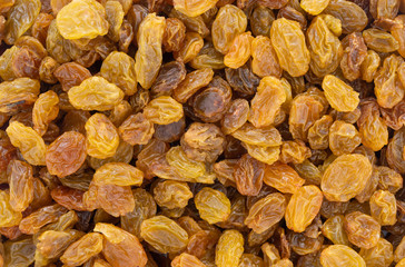 Top close view of a portion of golden raisins.