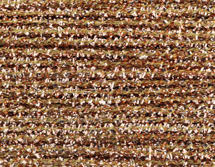 Very close view of gold glitter arts and crafts thread.