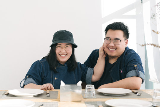 Portrait of young couple in the pizza shop