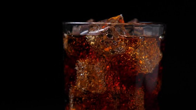 Fizzling coca cola in the glass