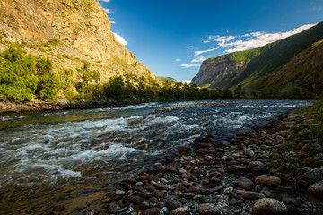 Rapid river of Chulyshman during sunset. Altai Republic, Russia